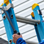 Hydro Savage Pressure Washing technician shows how to safely remove algae from your roof by performing a roof treatment